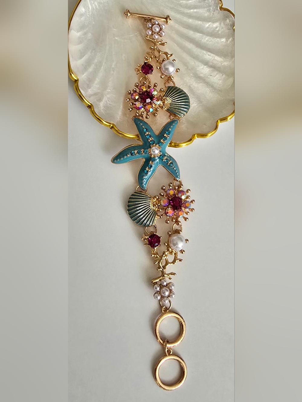 Gold-Plated Sea Star Bracelet with Turquoise Enamel & Pink Crystal Accents
